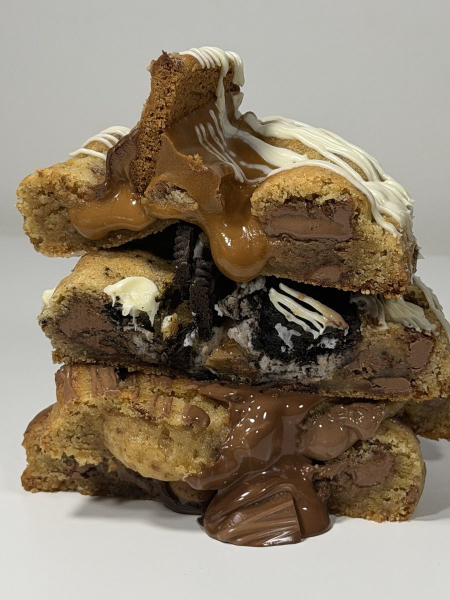Stack of three stuffed Argies cookies oozing Nutella and Biscoff